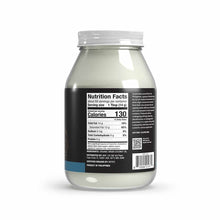Glass jar containing white coconut oil with black label displaying nutrition facts and product information.
