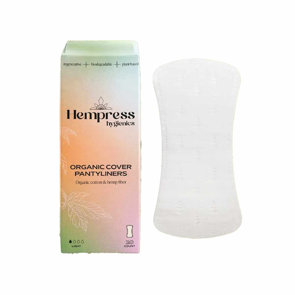 A pastel gradient Hempress box of organic cover pantyliners stands beside a single white pantyliner with a subtle embossed leaf pattern.