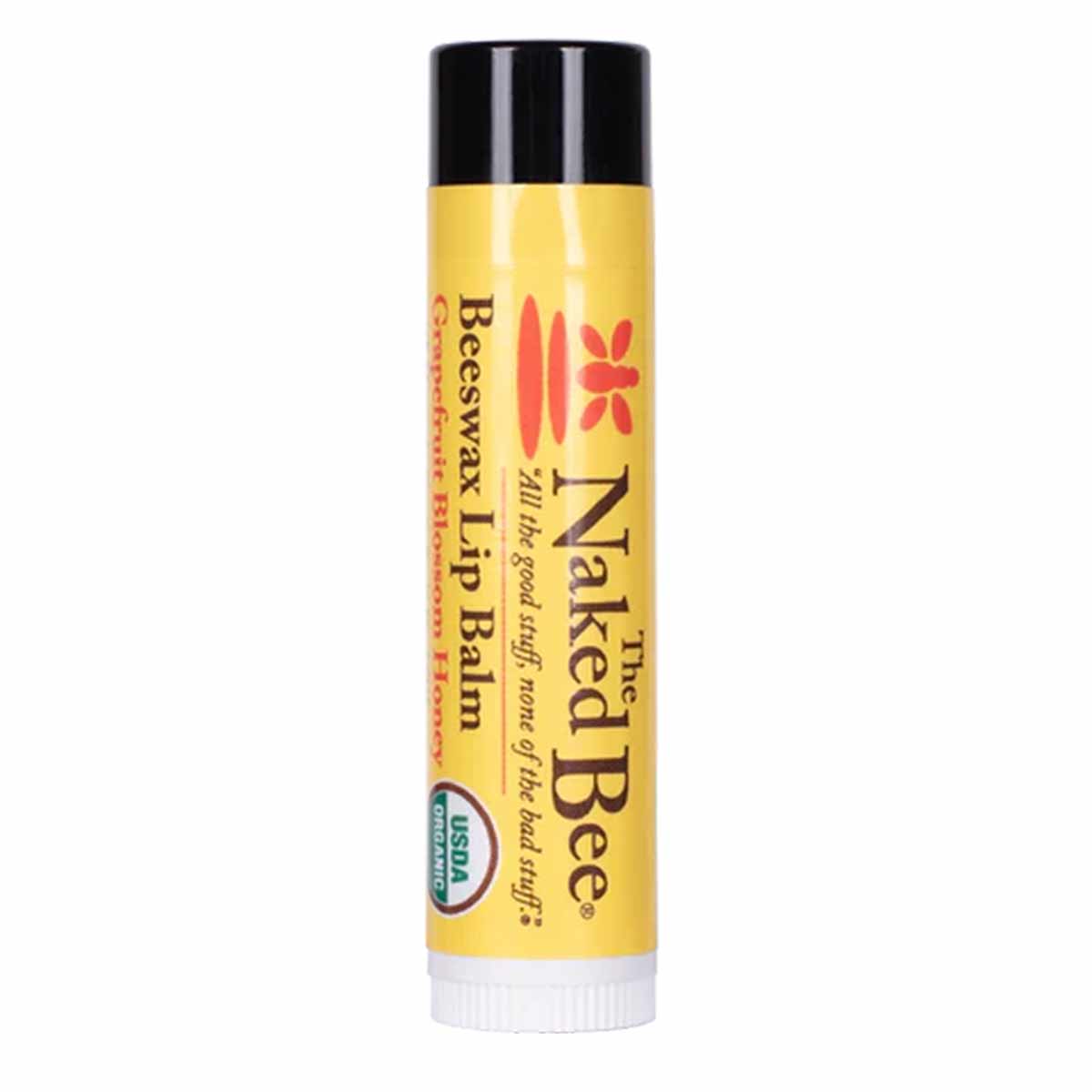 Beeswax lip balm stick with yellow label, black cap, and white applicator base.