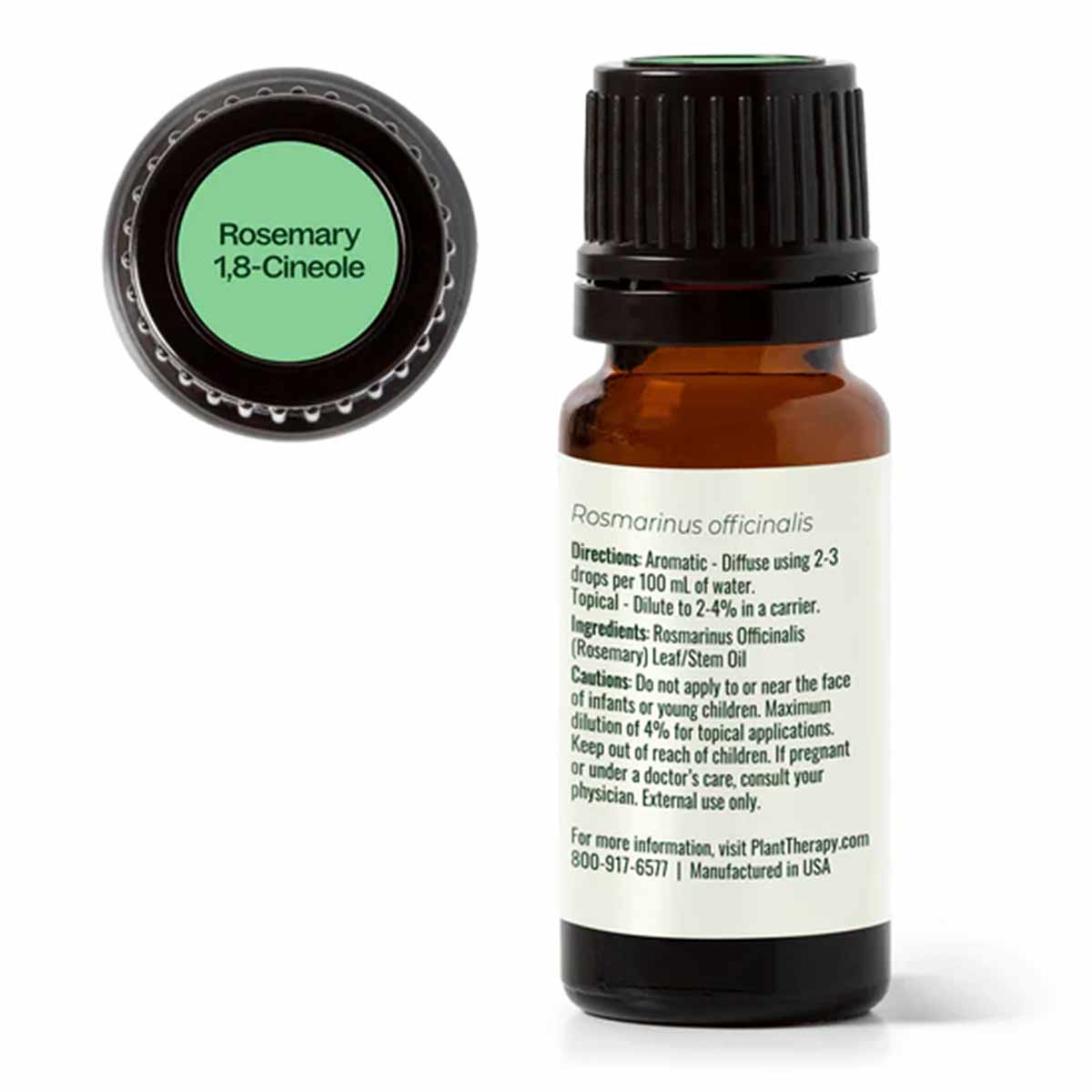 Amber glass bottle of rosemary essential oil with black cap and green label lid showing product name.