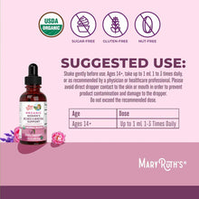 Dark glass bottle with dropper displaying USDA organic, sugar-free, gluten-free, and nut-free certification badges on pink ba