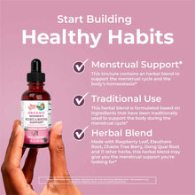 Hand holding a dark glass dropper bottle labeled "Organic Women's Wellness & Menstrual Support" against pink background with 