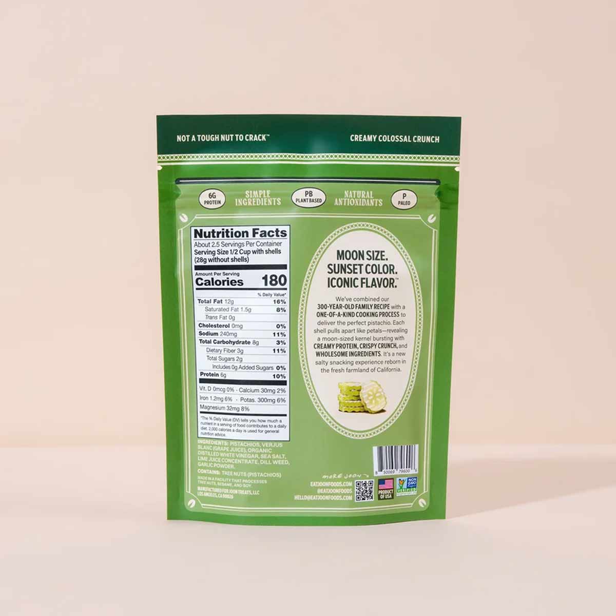 Green Joon pistachio package with nutrition facts, ingredient list, and product description on beige background.
