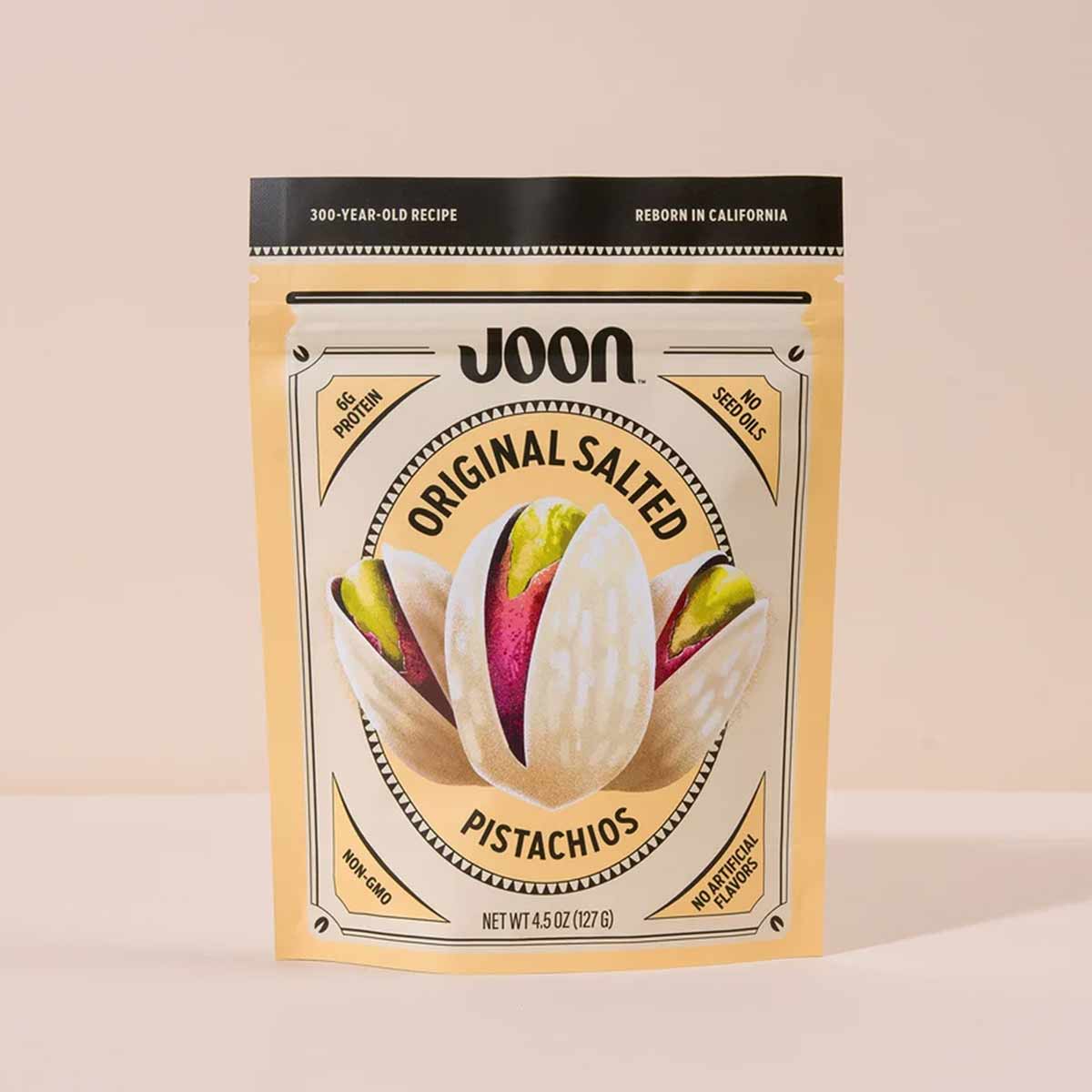 Joon Original Salted Pistachios package with cream and red pistachios displayed on gold pouch, 4.5 oz.