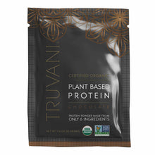 Truvani certified organic plant-based protein powder packet in chocolate flavor with gold decorative patterns on black backgr