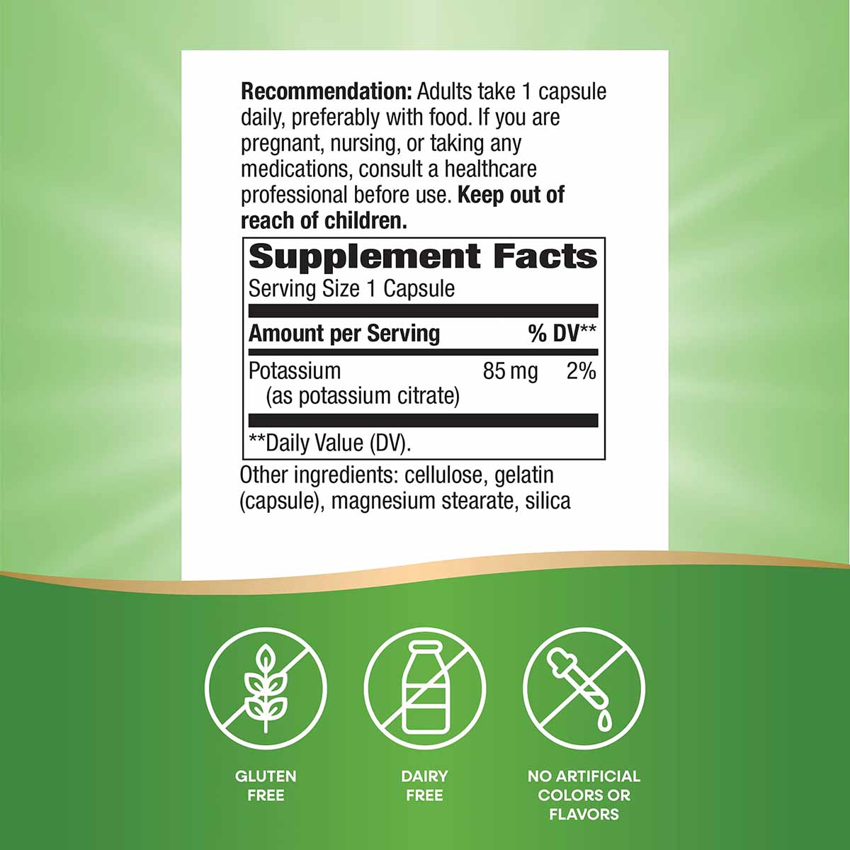 White label showing supplement facts for potassium capsules with three green icons below indicating gluten-free, dairy-free, 