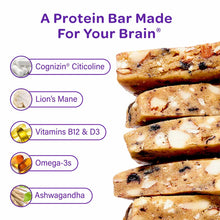 Stacked protein bars with white chunks and dark bits, labeled with ingredients including Cognizin Citicoline, Lion's Mane, Vi