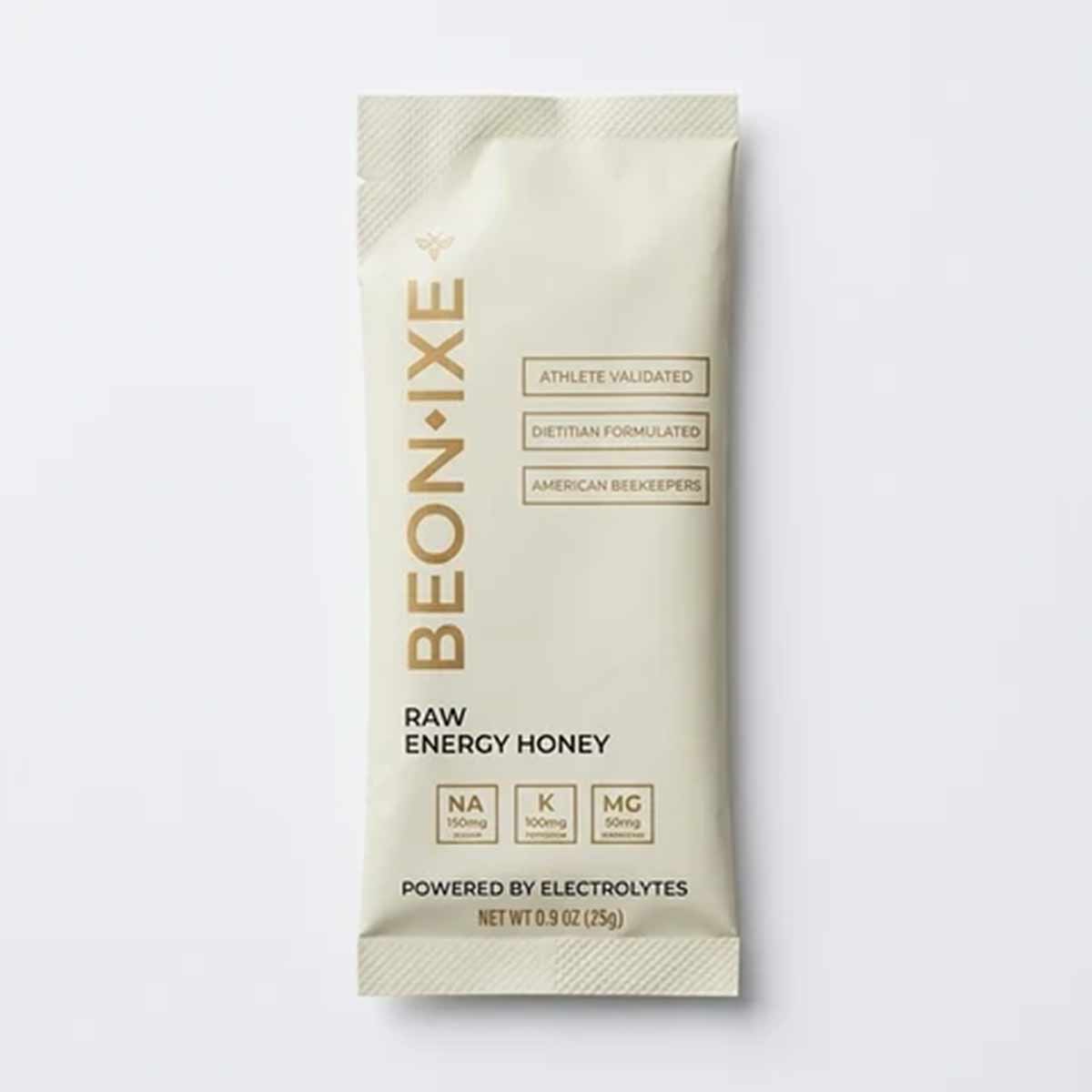 BEONIXE raw energy honey packet with electrolytes, 0.9 oz, cream-colored wrapper with gold text and nutrient labels.