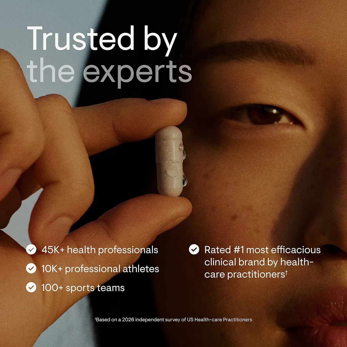 Person holding a white capsule supplement between fingers with text overlay about product endorsements.