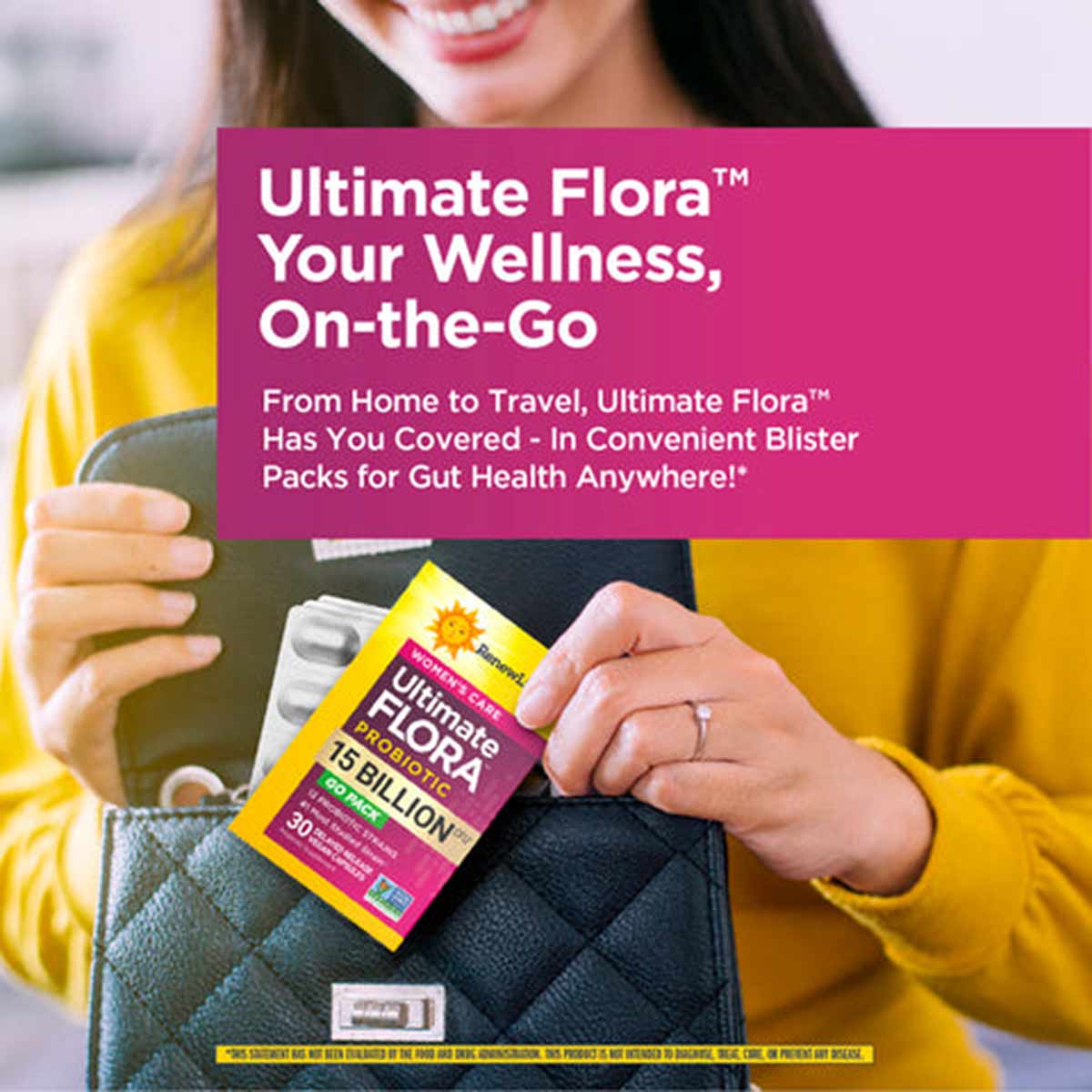 Woman in yellow cardigan holding Ultimate Flora probiotic supplement box with blister packs in a black bag.