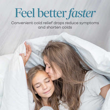 Adult and child resting under white blanket with "Feel better faster" text and cold relief product messaging above.