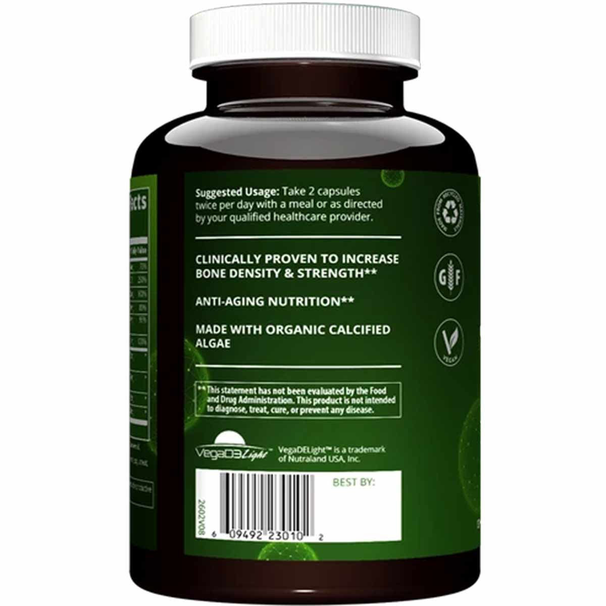 Black vegan supplement bottle with white screw cap and green label displaying usage instructions and ingredient information.