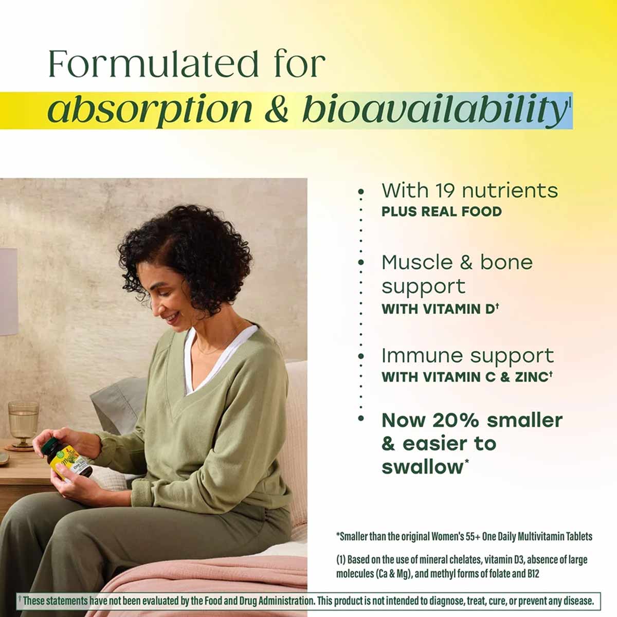 Woman holding yellow bottle of Megafood Women's 55+ One Daily Multivitamin tablets.