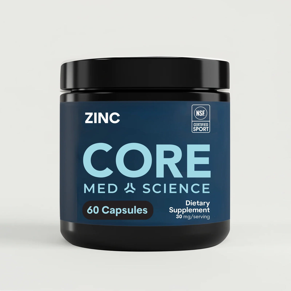 A black supplement jar with a navy label reads Zinc, Core Med Science, 60 Capsules, and carries an NSF Certified for Sport badge.